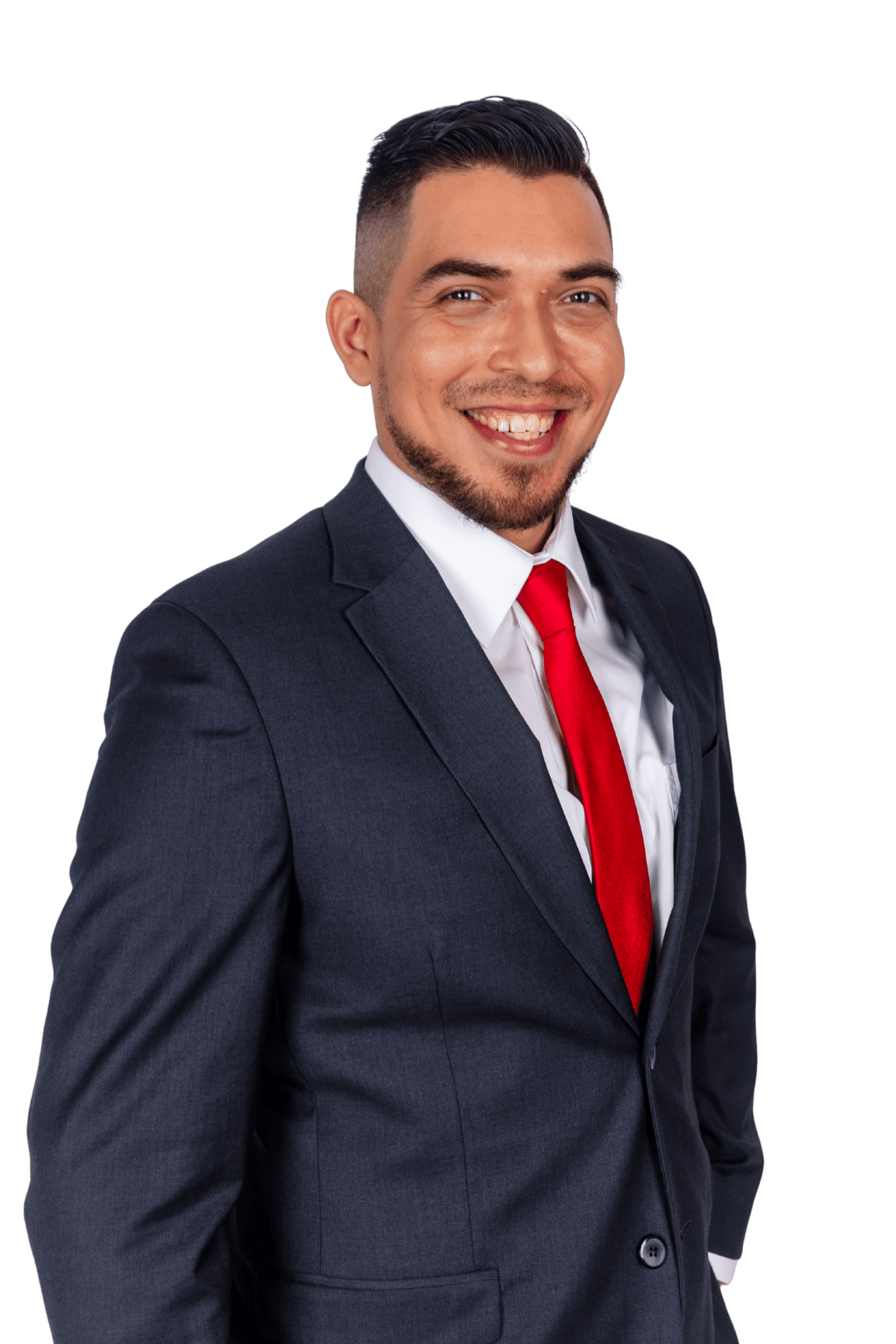 Ivan Michael in a dark suit and red tie, smiling at the camera